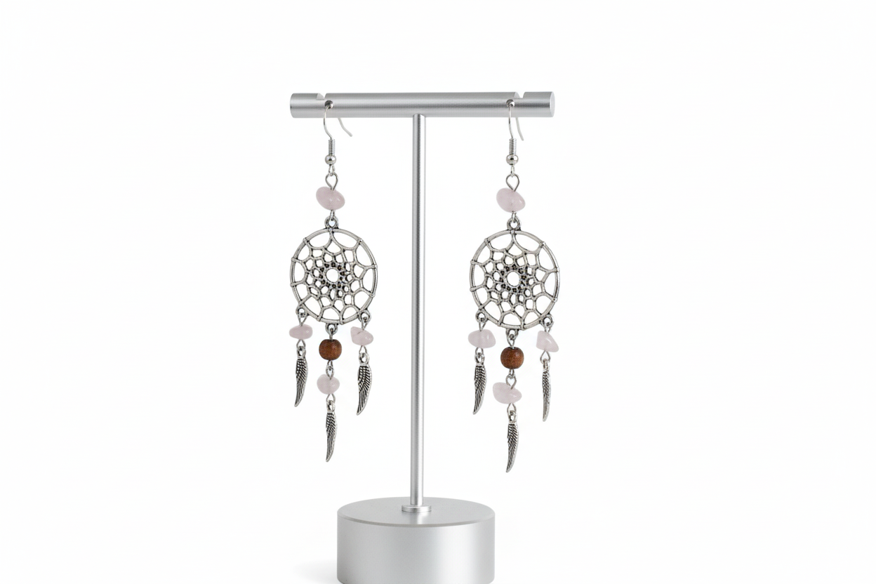 Embrace your inner dreamer with our beautiful dream catcher earrings. Adorned with glass beads and silver wings, these earrings add a touch of whimsy to any outfit. Let them catch your dreams and inspire you to chase them!