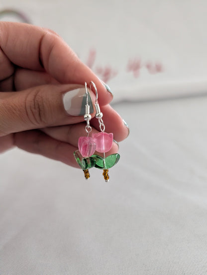 Delicate crystal and seed beads form an enchanting flower design, suspended from hypoallergenic 925 sterling silver hooks. These lightweight earrings measure just 1.5 inches, making them perfect for everyday elegance or layering with other pieces. At only 0.1 oz, they're comfortable enough to wear all day without fatigue. The shimmering bead work catches light beautifully, adding a touch of sparkle and sophistication to any outfit. Ideal for those who appreciate handcrafted jewelry with timeless appeal.