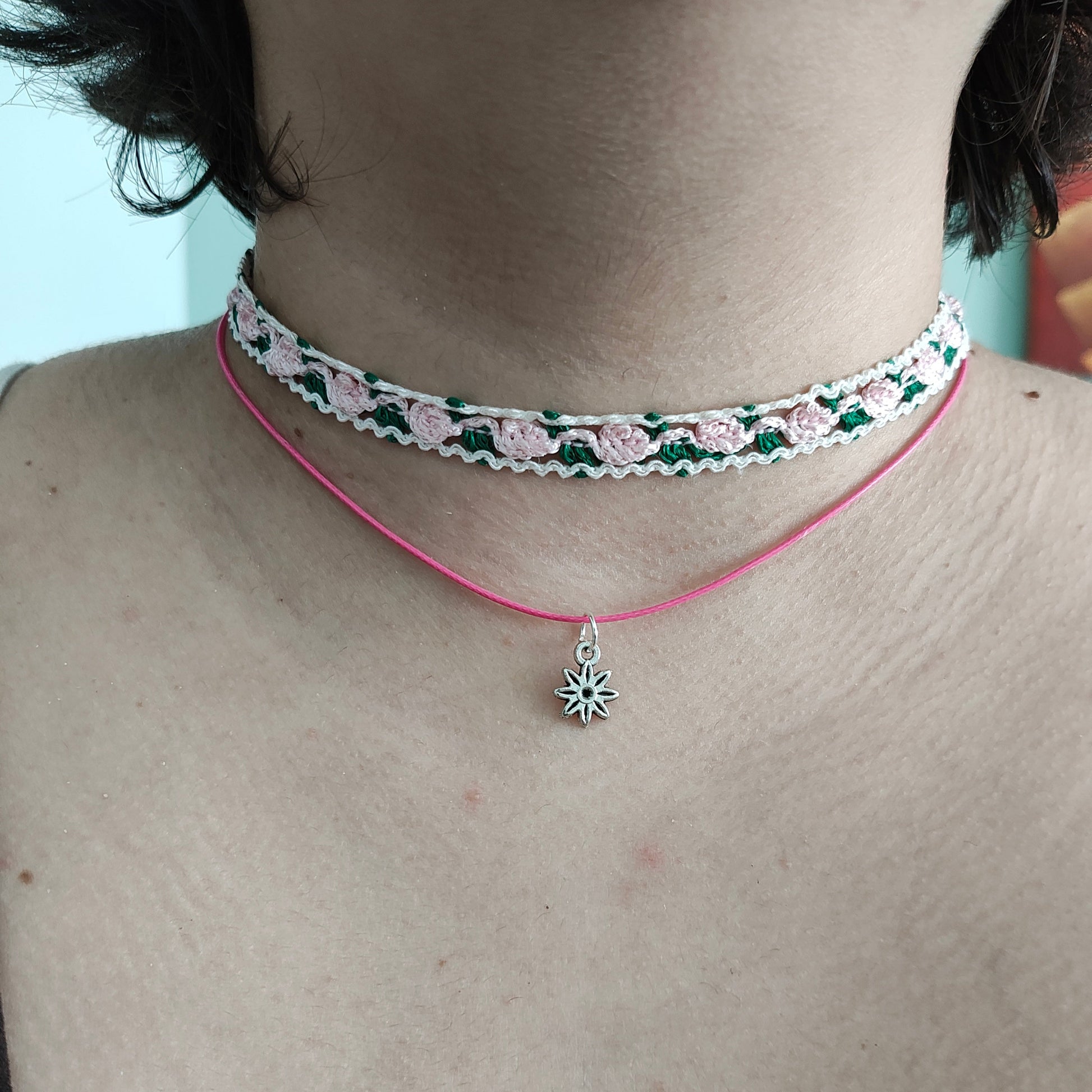 Add a sweet touch to your outfit with our pink rose lace choker necklace. Made with a single polyester strand and a flower charm, this playful piece will have you feeling fun and flirty. Perfect for any occasion, this necklace is sure to make a statement!