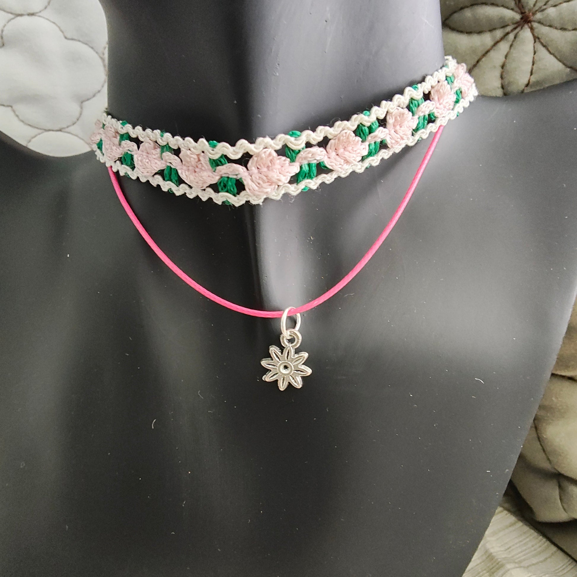 Add a sweet touch to your outfit with our pink rose lace choker necklace. Made with a single polyester strand and a flower charm, this playful piece will have you feeling fun and flirty. Perfect for any occasion, this necklace is sure to make a statement!