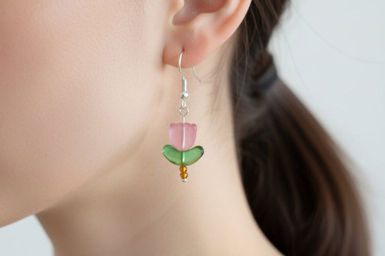 Delicate crystal and seed beads form an enchanting tulip design, suspended from hypoallergenic 925 sterling silver hooks. These lightweight earrings measure just 1.5 inches, making them perfect for everyday elegance or layering with other pieces. At only 0.1 oz, they're comfortable enough to wear all day without fatigue. The shimmering bead work catches light beautifully, adding a touch of sparkle and sophistication to any outfit. Ideal for those who appreciate handcrafted jewelry with timeless appeal.