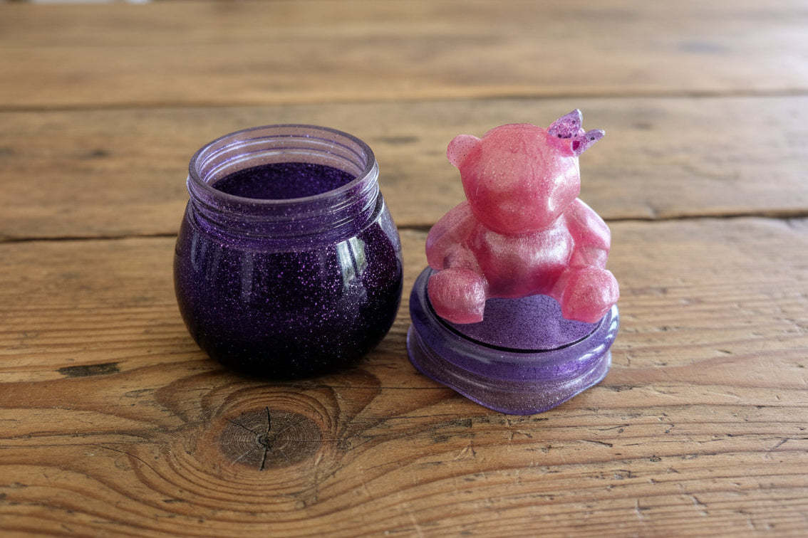 Clear resin jar with bear-shaped screw-on lid