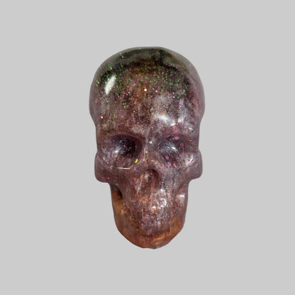 Add a unique touch to your home decor with our Knickknack - Resin small skull. Made with high-quality resin, this skull is a perfect blend of edginess and creativity. Elevate your space with this eye-catching piece that will surely spark your imagination.