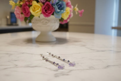 Elevate your everyday style with these enchanting butterfly earrings, featuring delicate silver chains, a charming bow accent, and sparkling crystal beads suspended from classic silver ball post studs. At approximately 3 inches in length, they offer the perfect balance of presence and wearability, making them ideal for both casual outings and special occasions. Weighing just 0.18 oz, these lightweight beauties won't weigh you down, allowing you to wear them comfortably all day long. The intricate design com