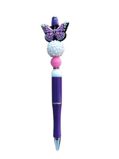Unleash creativity with our Pen - Butterfly silicon beaded acrylic pen! Featuring sleek black ink, this pen is adorned with beautiful butterfly beads, perfect for adding a touch of whimsy to any writing task. Express yourself with every stroke!