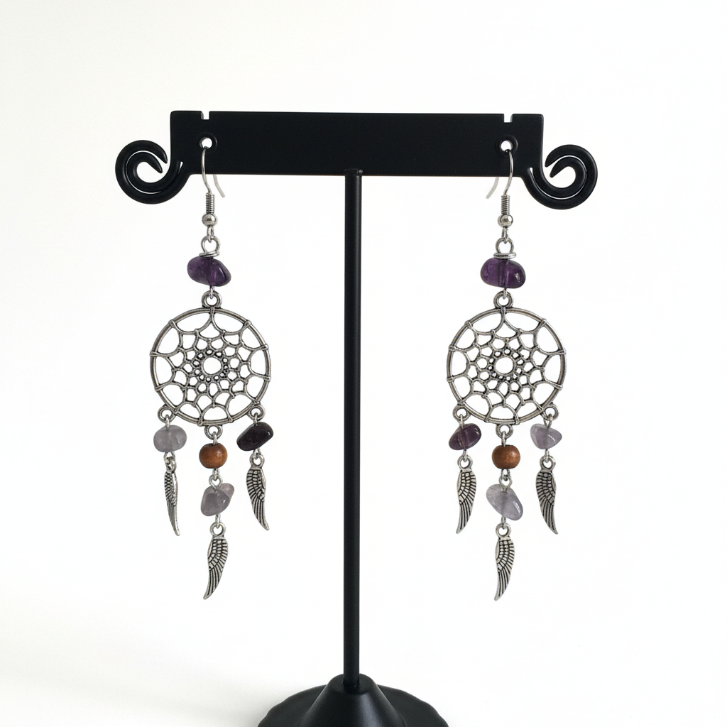 Embrace your inner dreamer with our beautiful dream catcher earrings. Adorned with glass beads and silver wings, these earrings add a touch of whimsy to any outfit. Let them catch your dreams and inspire you to chase them!