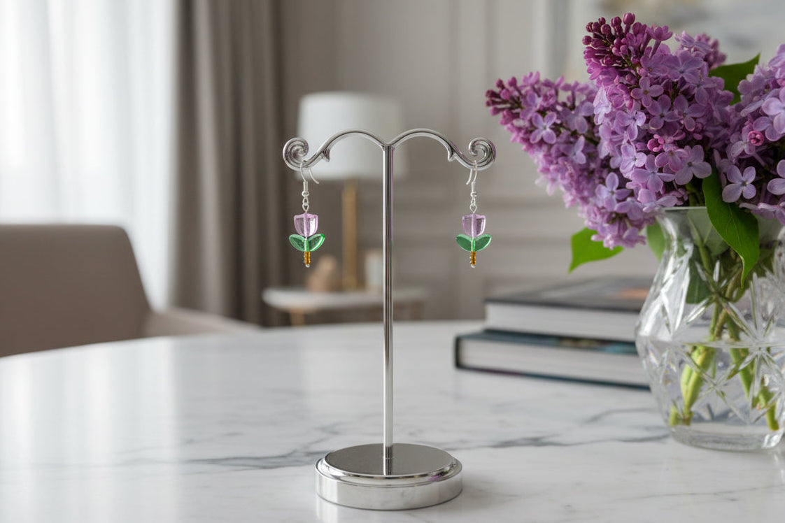 Delicate crystal and seed beads form an enchanting flower design, suspended from hypoallergenic 925 sterling silver hooks. These lightweight earrings measure just 1.5 inches, making them perfect for everyday elegance or layering with other pieces. At only 0.1 oz, they're comfortable enough to wear all day without fatigue. The shimmering bead work catches light beautifully, adding a touch of sparkle and sophistication to any outfit. Ideal for those who appreciate handcrafted jewelry with timeless appeal.