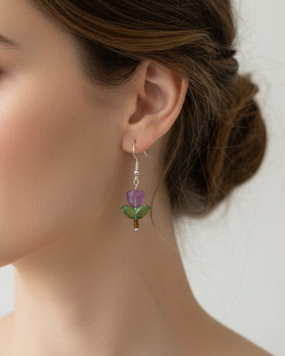 Delicate crystal and seed beads form an enchanting flower design, suspended from hypoallergenic 925 sterling silver hooks. These lightweight earrings measure just 1.5 inches, making them perfect for everyday elegance or layering with other pieces. At only 0.1 oz, they're comfortable enough to wear all day without fatigue. The shimmering bead work catches light beautifully, adding a touch of sparkle and sophistication to any outfit. Ideal for those who appreciate handcrafted jewelry with timeless appeal.