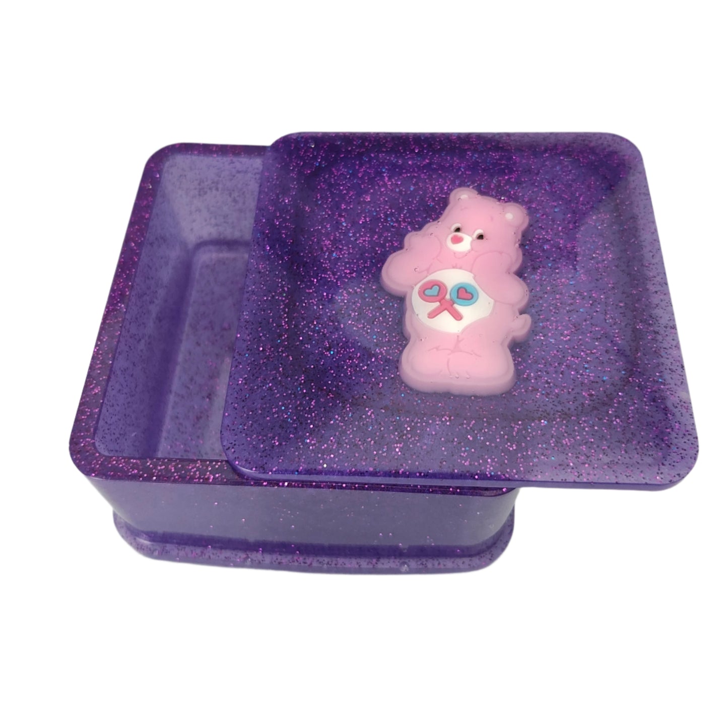 Elevate your jewelry storage game with our Knickknack resin square box. The character lid adds personality to this functional piece, keeping your treasures organized and protected. Made with high-quality resin, it's durable and long-lasting. Add a touch of charm to your vanity or dresser.