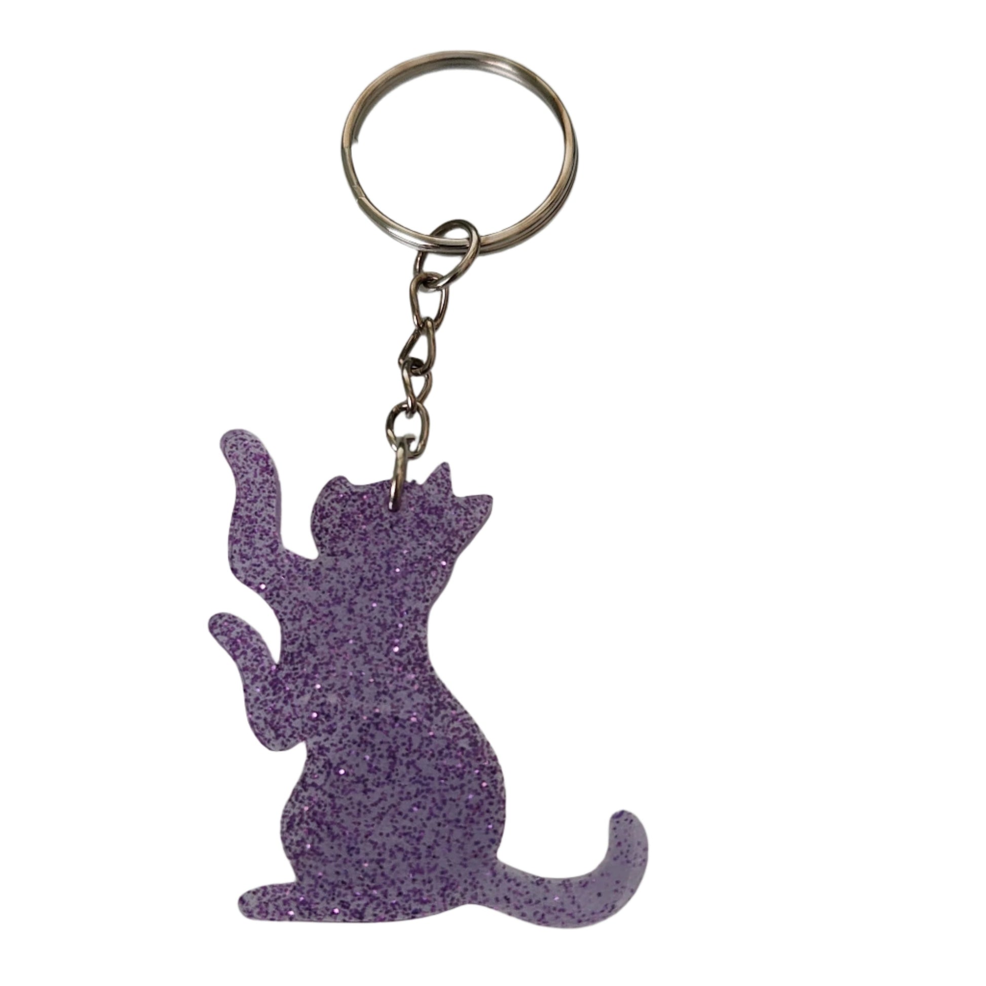 Don't let your keys get lost in the fur-ever! Show your cat-itude with this purrfect accessory - a keychain featuring an adorable, purring (or sleeping) kitty! The Keychain - Resin Cat is guaranteed to add an extra dose of meow-velous personality to your keys and your life.