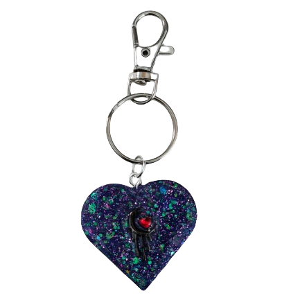 Show your heart is in the right place with this one-of-a-kind keychain! Its resin heart design is as unique as it is eye-catching – no two are alike. Plus, it's lightweight, making it perfect for carrying everywhere you go. Get your keychain on!
