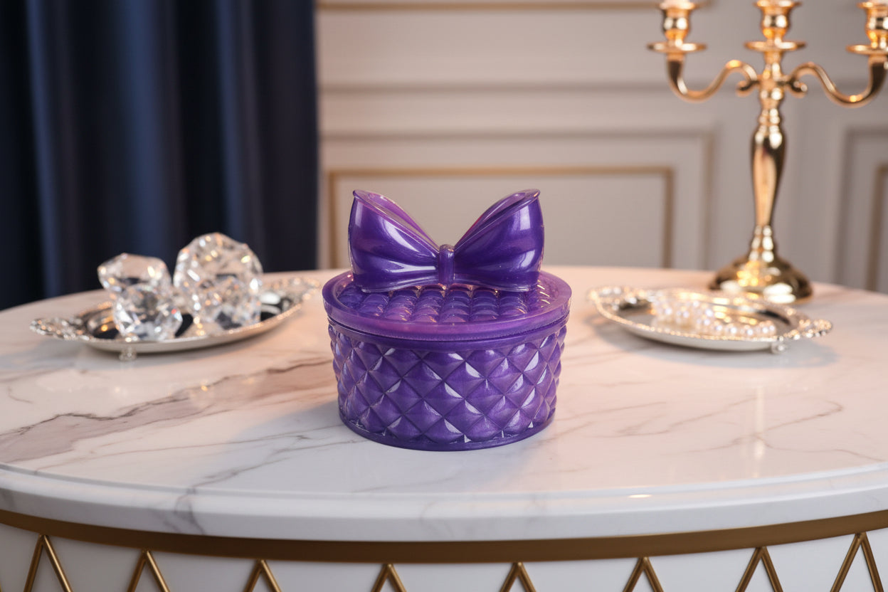 This beautifully crafted resin round trinket box with a bow lid is perfect for storing your delicate items. The intricate design adds a touch of elegance and sophistication to any room. Keep your trinkets safe and organized in this stylish and functional piece.