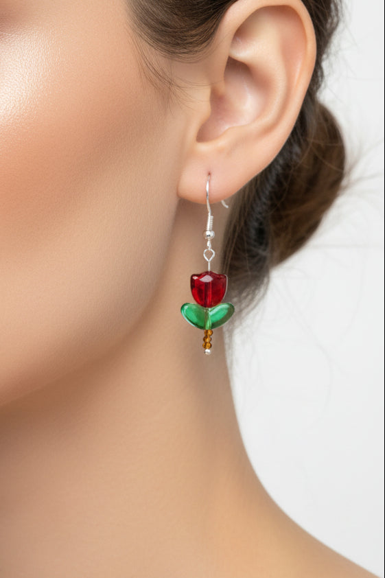 Delicate crystal and seed beads form an enchanting tulip design, suspended from hypoallergenic 925 sterling silver hooks. These lightweight earrings measure just 1.5 inches, making them perfect for everyday elegance or layering with other pieces. At only 0.1 oz, they're comfortable enough to wear all day without fatigue. The shimmering bead work catches light beautifully, adding a touch of sparkle and sophistication to any outfit. Ideal for those who appreciate handcrafted jewelry with timeless appeal.