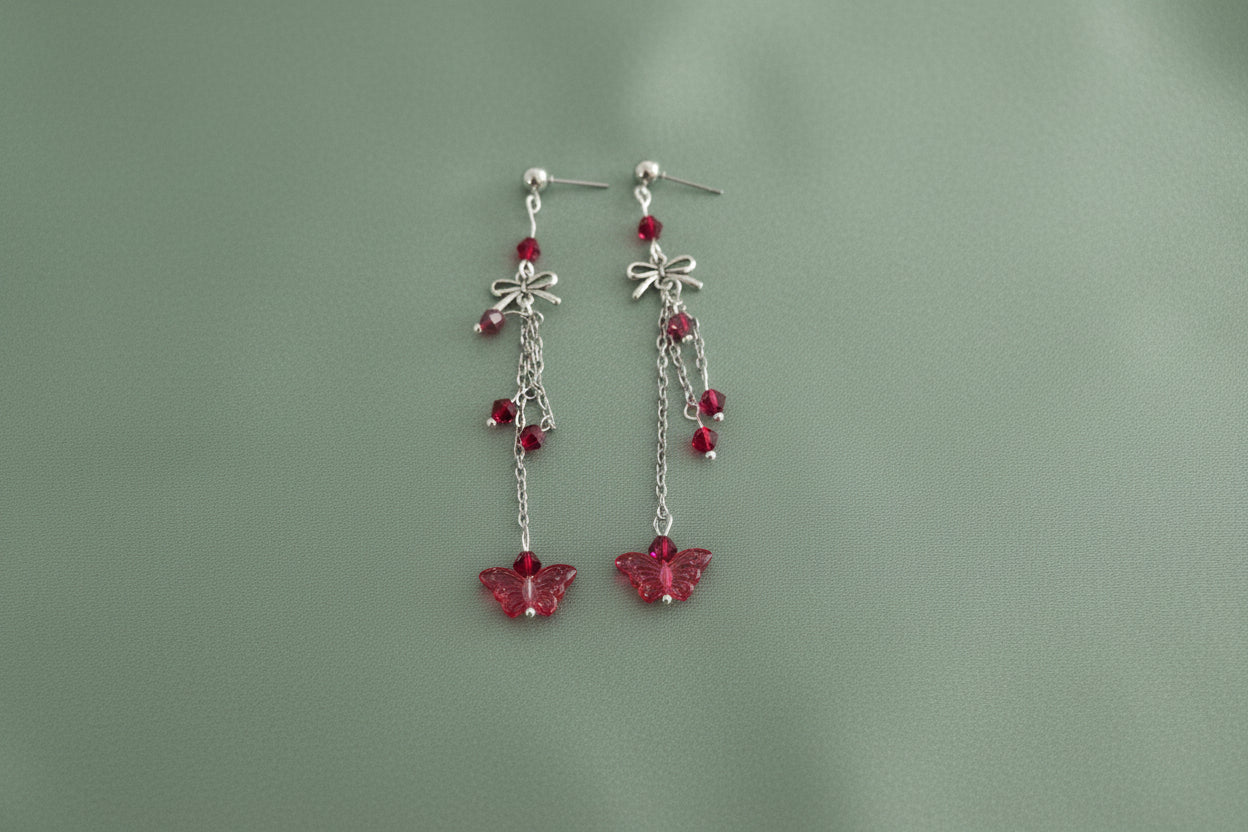 Elevate your everyday style with these enchanting butterfly earrings, featuring delicate silver chains, a charming bow accent, and sparkling crystal beads suspended from classic silver ball post studs. At approximately 3 inches in length, they offer the perfect balance of presence and wearability, making them ideal for both casual outings and special occasions. Weighing just 0.18 oz, these lightweight beauties won't weigh you down, allowing you to wear them comfortably all day long. The intricate design com