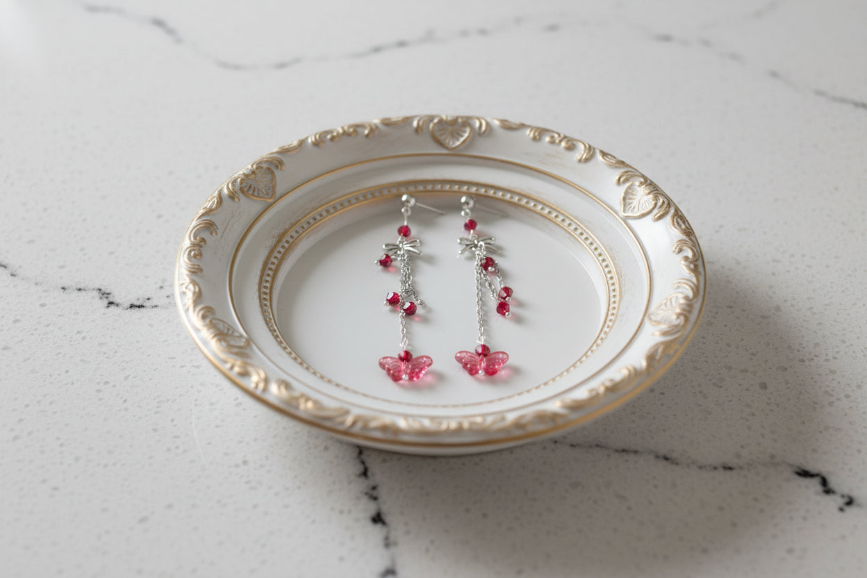 Elevate your everyday style with these enchanting butterfly earrings, featuring delicate silver chains, a charming bow accent, and sparkling crystal beads suspended from classic silver ball post studs. At approximately 3 inches in length, they offer the perfect balance of presence and wearability, making them ideal for both casual outings and special occasions. Weighing just 0.18 oz, these lightweight beauties won't weigh you down, allowing you to wear them comfortably all day long. The intricate design com