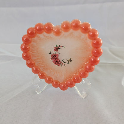 Elevate your space with our Resin Heart Trinket Tray. Formed into a heart shape, this tray is perfect for holding and displaying your small trinkets and treasures. Made of durable resin, it adds a touch of charm to any room while keeping your items organized and easily accessible.