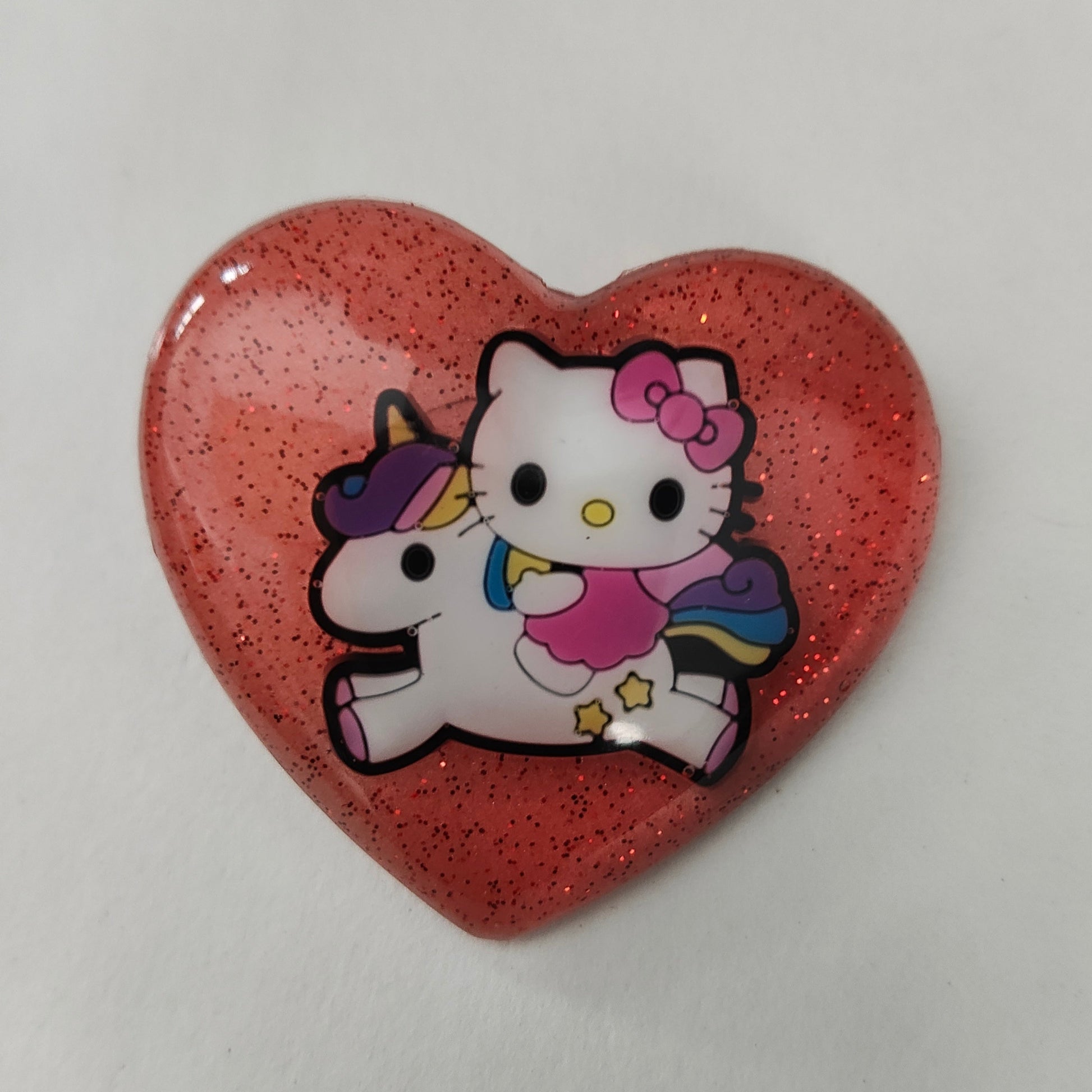 Introducing our playful 3D Hello Kitty pin, complete with a silver butterfly clutch. Measuring 1.75 x 2 inches and weighing only 0.40 ounces, this fun and quirky accessory is perfect for any fan of this beloved character. Add some charm to your outfit with this unique pin today!

Pin - 3D hello kitty resin pin with silver butterfly clutch