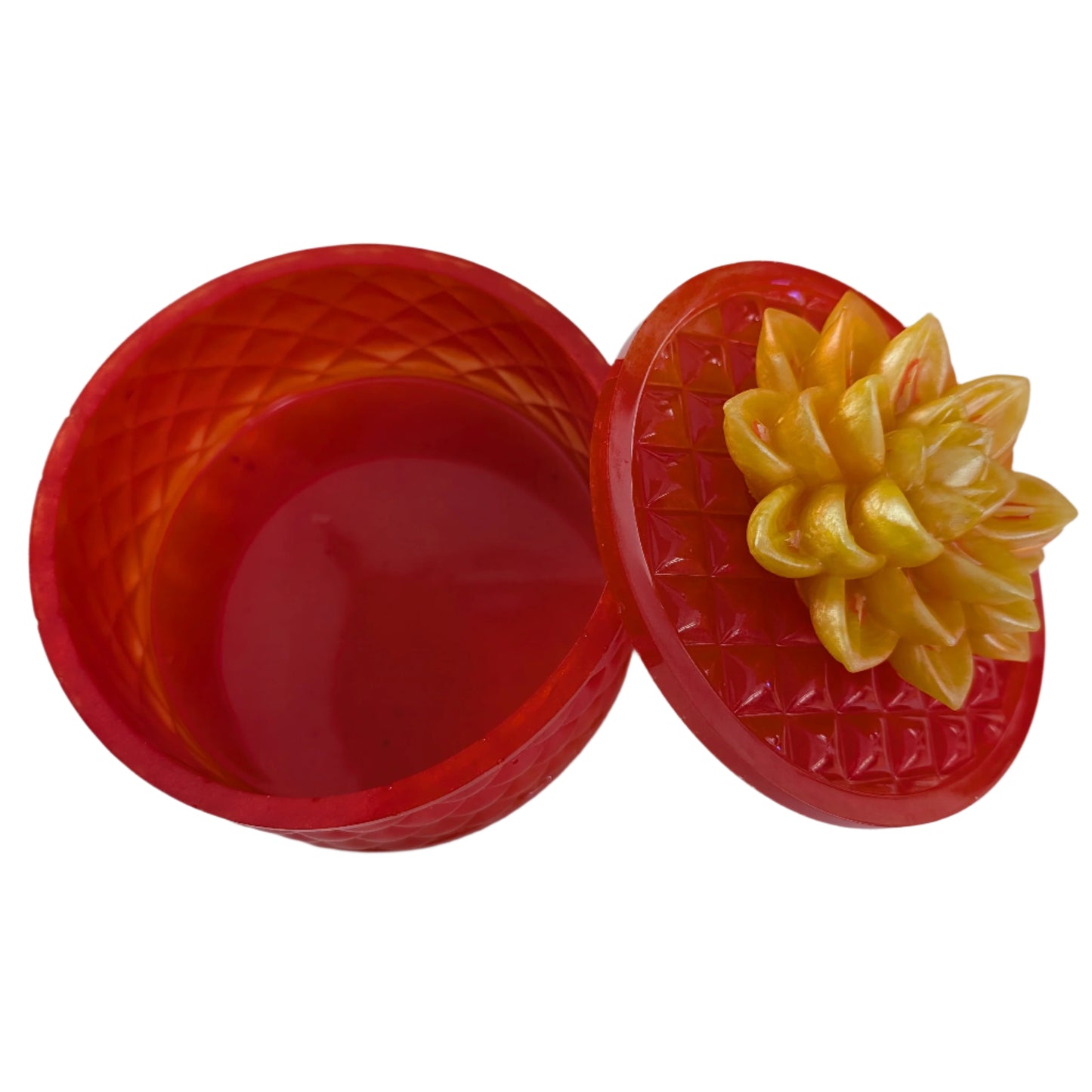 Keep your tiniest treasures safe in our round trinket box. With a charming resin design and a beautiful flower lid, it adds a playful touch to any space. At approximately 5 x 5 in, 4.25 in height, and weighing 11.7 oz, it's perfect for your precious items.