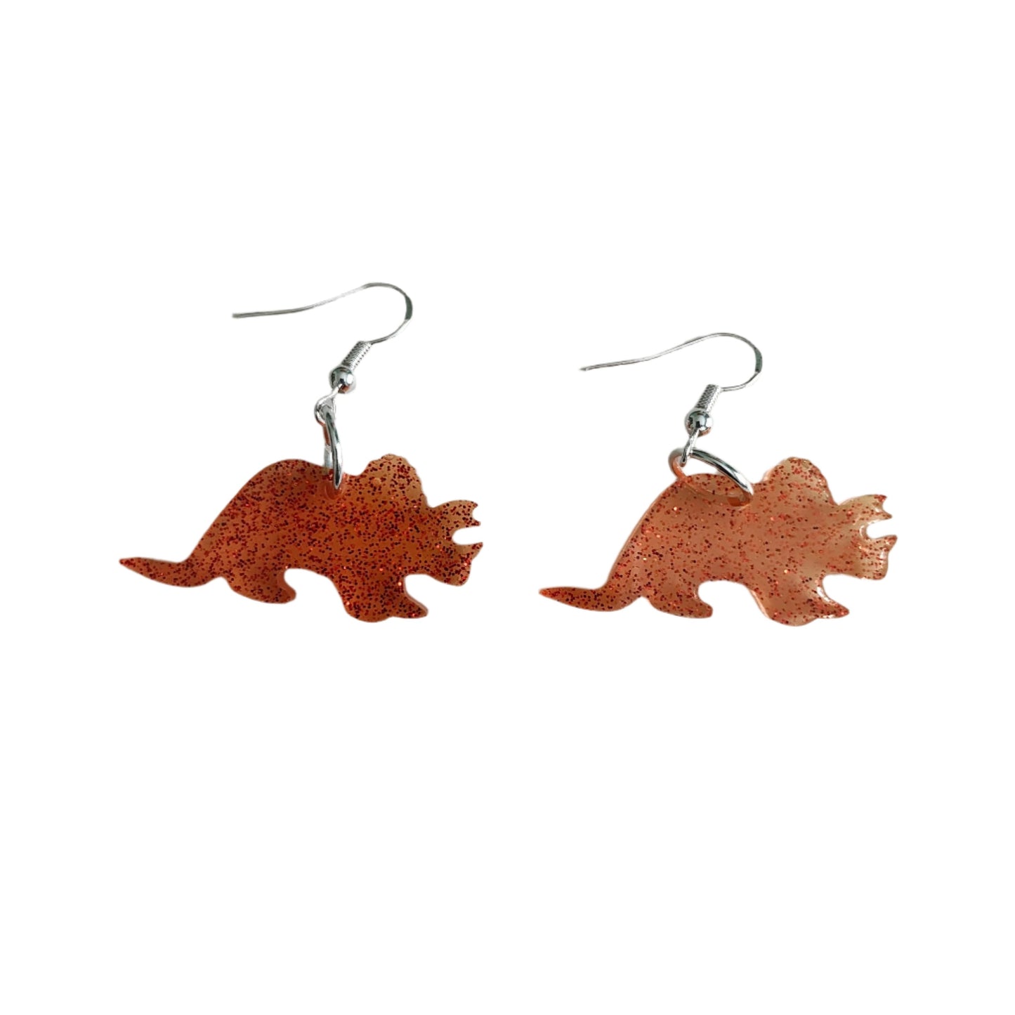 Unleash your wild side with these unique dinosaur earrings! Made of high-quality resin, these earrings are lightweight and comfortable to wear all day long. The perfect accessory for any dinosaur lover, these earrings are sure to add a fierce touch to any outfit. Get yours today and make a statement!