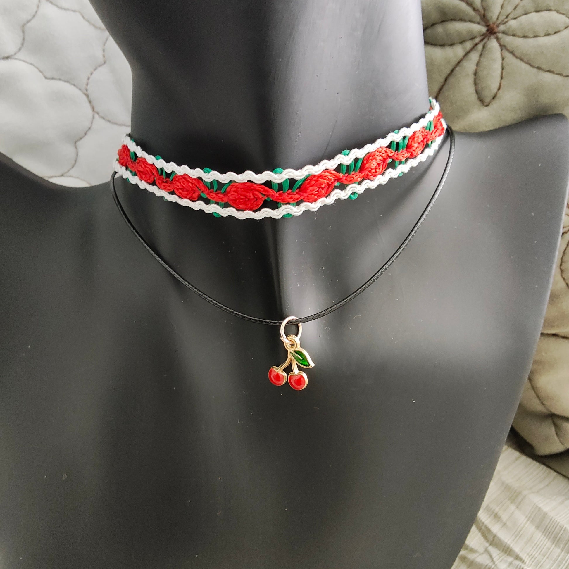 Add a sweet touch to your outfit with our red rose lace choker necklace. Made with a single polyester strand and a cherry charm, this playful piece will have you feeling fun and flirty. Perfect for any occasion, this necklace is sure to make a statement!