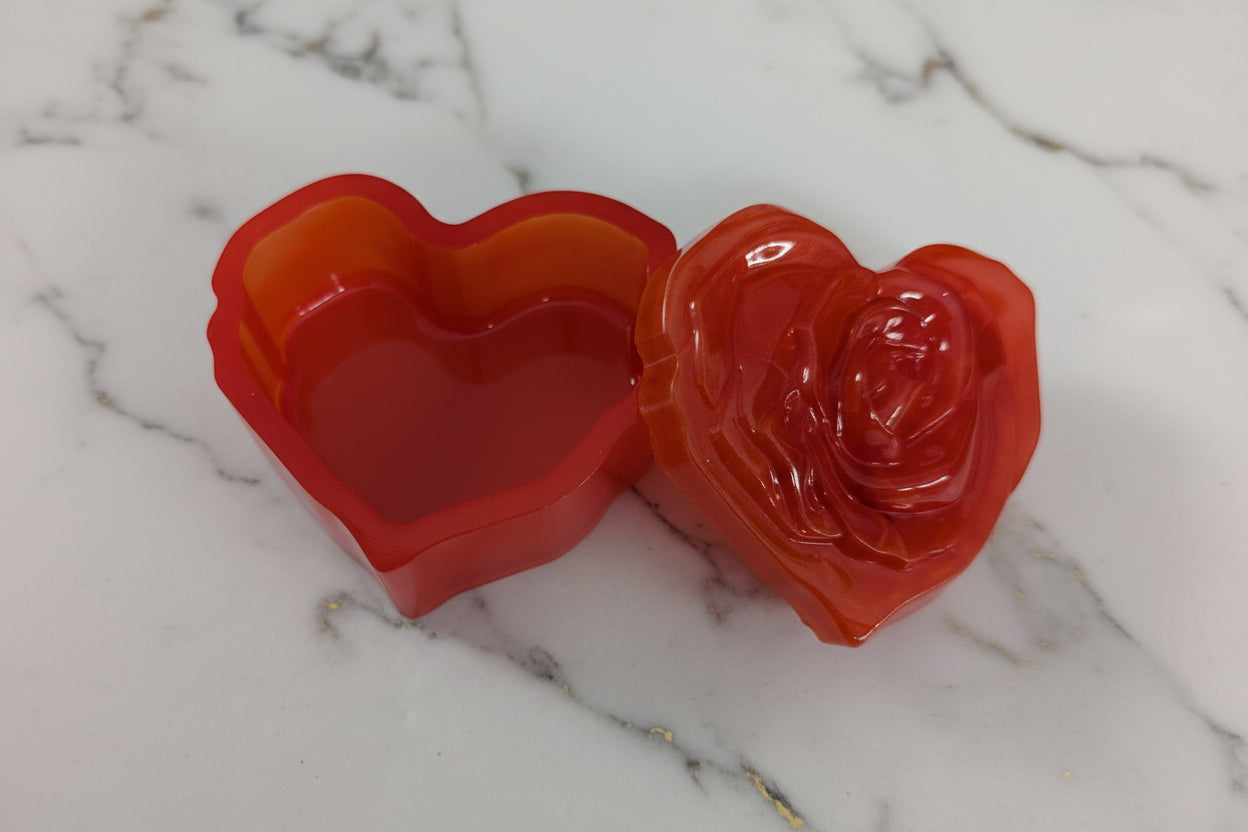 Elevate your space with this Resin Rose Lid Trinket Box, a charming blend of elegance and practicality. Its delicate resin rose lid adds a touch of timeless beauty, while the compact design keeps your small treasures organized and within reach. Perfect for jewelry, keepsakes, or special mementos, this trinket box makes a thoughtful gift or a stylish addition to your own collection. Add a graceful accent to your décor and keep your cherished items safe in style.