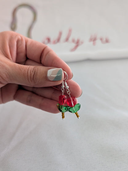 Delicate crystal and seed beads form an enchanting tulip design, suspended from hypoallergenic 925 sterling silver hooks. These lightweight earrings measure just 1.5 inches, making them perfect for everyday elegance or layering with other pieces. At only 0.1 oz, they're comfortable enough to wear all day without fatigue. The shimmering bead work catches light beautifully, adding a touch of sparkle and sophistication to any outfit. Ideal for those who appreciate handcrafted jewelry with timeless appeal.