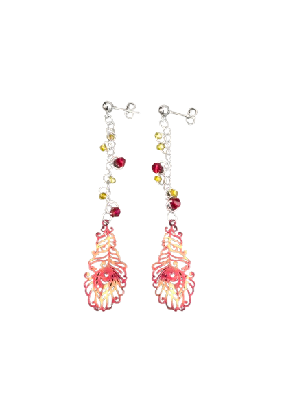 Inspire with our Filigree feather earrings. Made with stainless steel chains and delicate seed beads, these earrings feature intricate filigree feathers on ball post studs. Lightweight and elegant, perfect for any occasion. Elevate your style now!