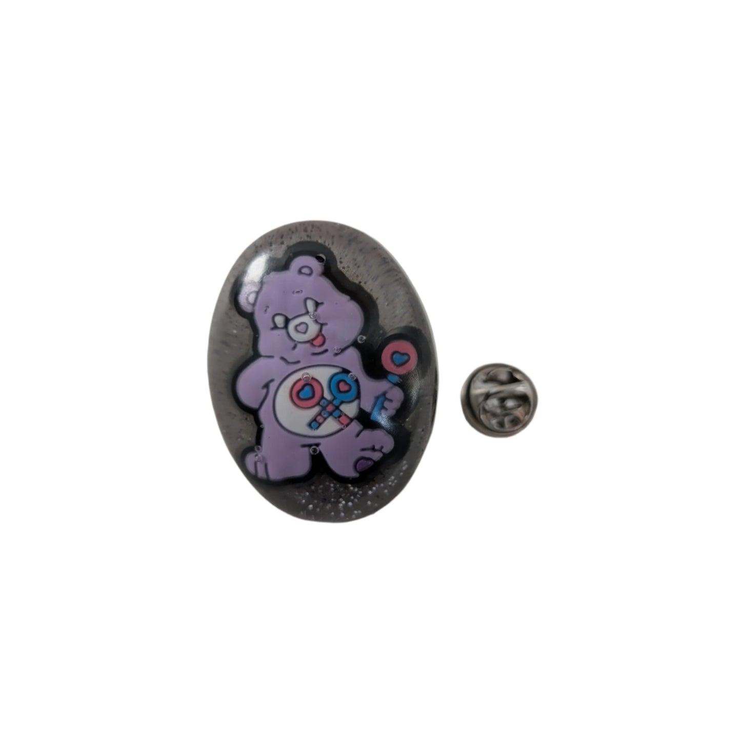 This 3D Care Bears resin pin adds a playful and nostalgic touch to any outfit or accessory. Crafted with detailed resin and secured by a silver butterfly clutch, it ensures both style and durability. Perfect for collectors or fans looking to brighten their day with a charming, wearable keepsake.