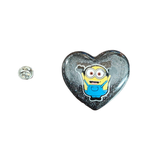 Unleash your inner child with our adorable 3D resin minions pin! This pin features a silver butterfly clutch for secure fastening. Show off your fun side and add a pop of color to any outfit. Perfect for any pin collector or lover of all things cute!