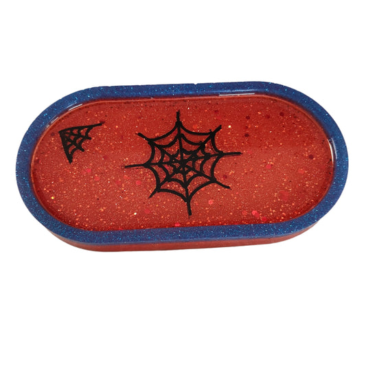 This Knickknack trinket dish not only adds a fun touch to any space with its super hero theme, but also serves as a functional and stylish storage option for small items. Made of durable resin, it is designed to keep jewelry, change, and other trinkets organized and easily accessible.