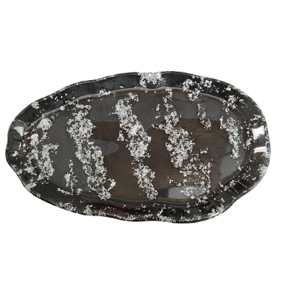 This trinket dish is the perfect way to store and display your favorite trinkets and treasures. The large, wavy oval design adds a unique touch to any space, while the durable resin material ensures long-lasting use. Keep your belongings organized and beautifully showcased with this must-have accessory!