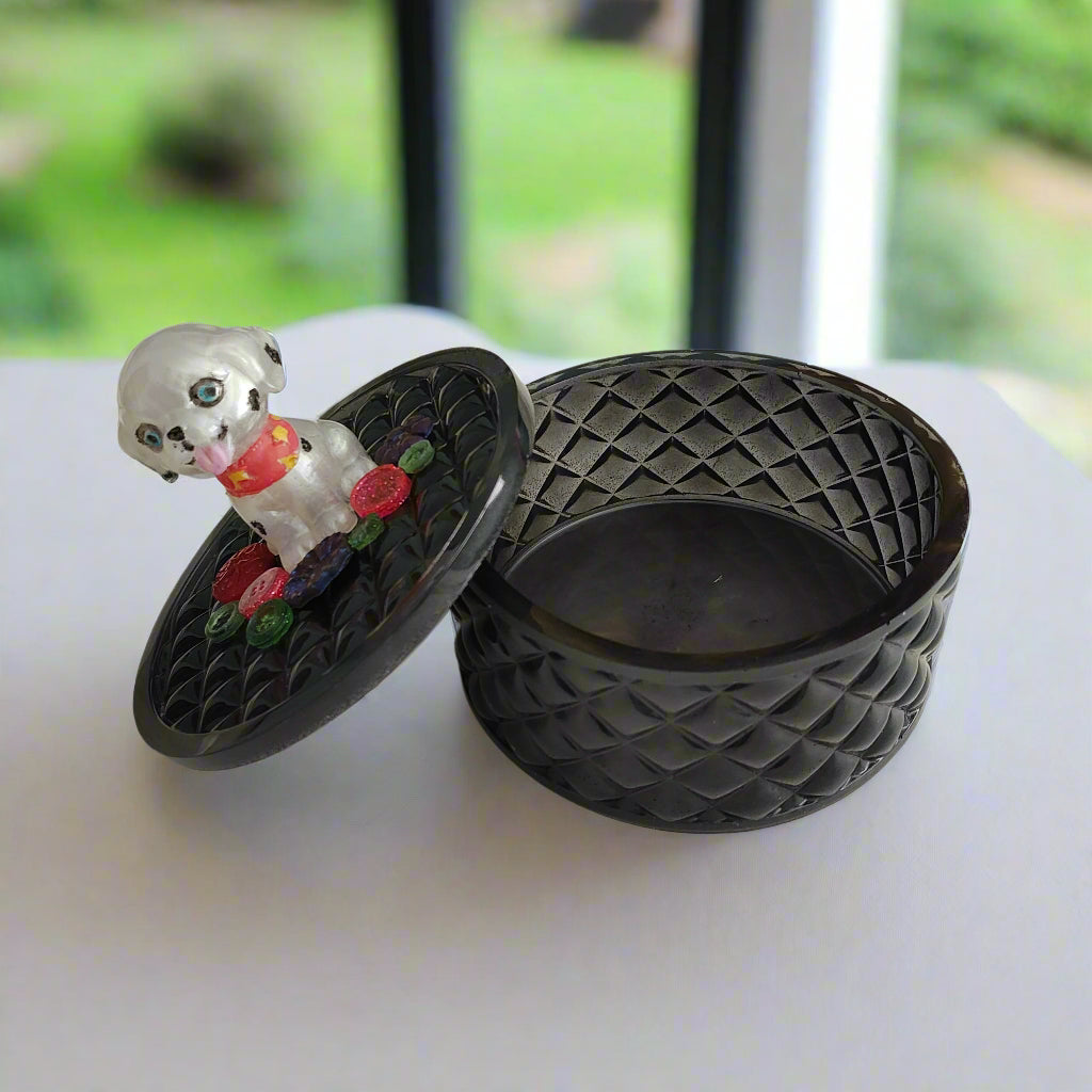 Keep your precious trinkets safe in this quirky Knickknack box! The resin round box features a playful dalmatian lid, adding a touch of fun to your storage. With a height of 5 inches and a dish depth of 2 inches, it's perfect for keeping your jewelry and small items organized. Weighing only 11 ounces, it's lightweight and easy to move around. 