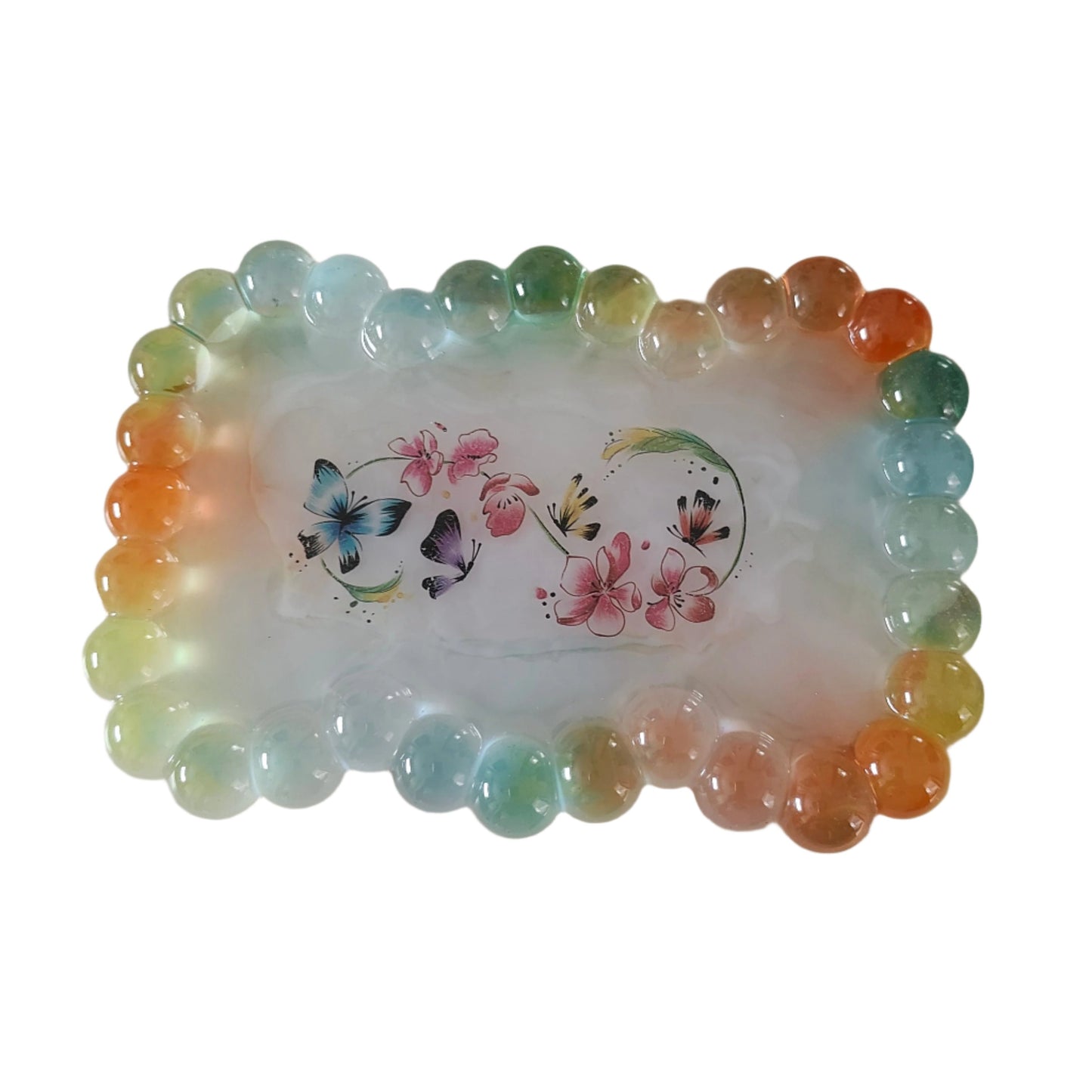 Elevate your trinket game with our Resin bow shape jewelry/trinket tray! Made of high-quality resin, this tray is as durable as it is stylish. Perfect for holding jewelry, keys, or other small items, it's a must-have addition to any dressing table or bedside. Get yours today and add a touch of elegance to your space!