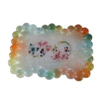 Elevate your trinket game with our Resin bow shape jewelry/trinket tray! Made of high-quality resin, this tray is as durable as it is stylish. Perfect for holding jewelry, keys, or other small items, it's a must-have addition to any dressing table or bedside. Get yours today and add a touch of elegance to your space!