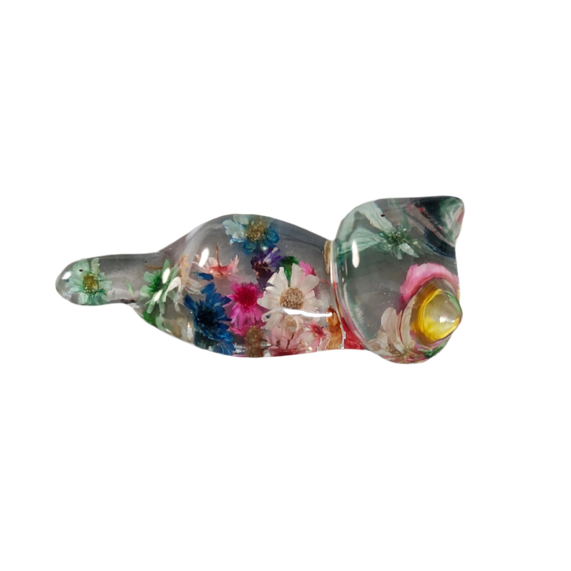 Add some purrfect charm to your home with our playful "Knickknack" resin cat trinket. This small, clear feline is adorned with delicate flowers, making it both stylish and quirky. A unique addition to any knickknack collection.