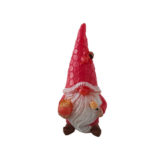 Add a touch of whimsy and charm to your home with our Resin Gnome with honey pot trinket! This endearing gnome figurine is made of durable resin and comes with a sweet little honey pot, perfect for adding a cozy and playful atmosphere to any room. Bring joy to your space with this adorable gnome!
