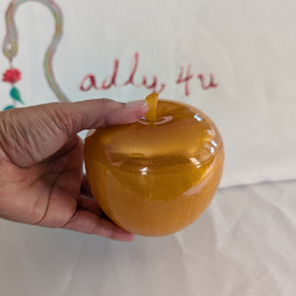 hand crafted with epoxy resin..

Epoxy resin is typically smooth, rigid, and non-porous, similar to a hard plastic or glass.

Knickknack - Resin apple trinket with lid