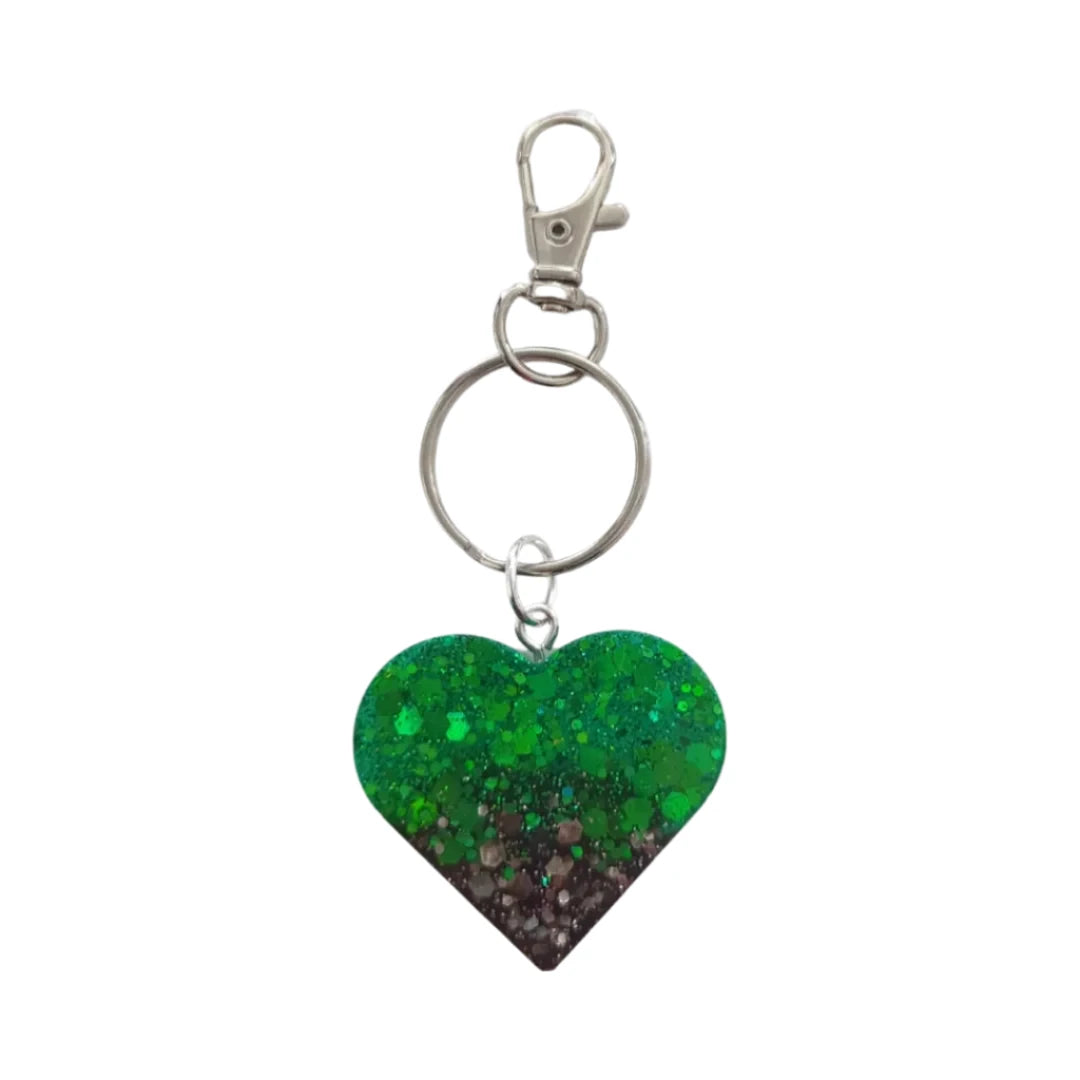 Show your heart is in the right place with this one-of-a-kind keychain! Its resin heart design is as unique as it is eye-catching – no two are alike. Plus, it's lightweight, making it perfect for carrying everywhere you go. Get your keychain on!