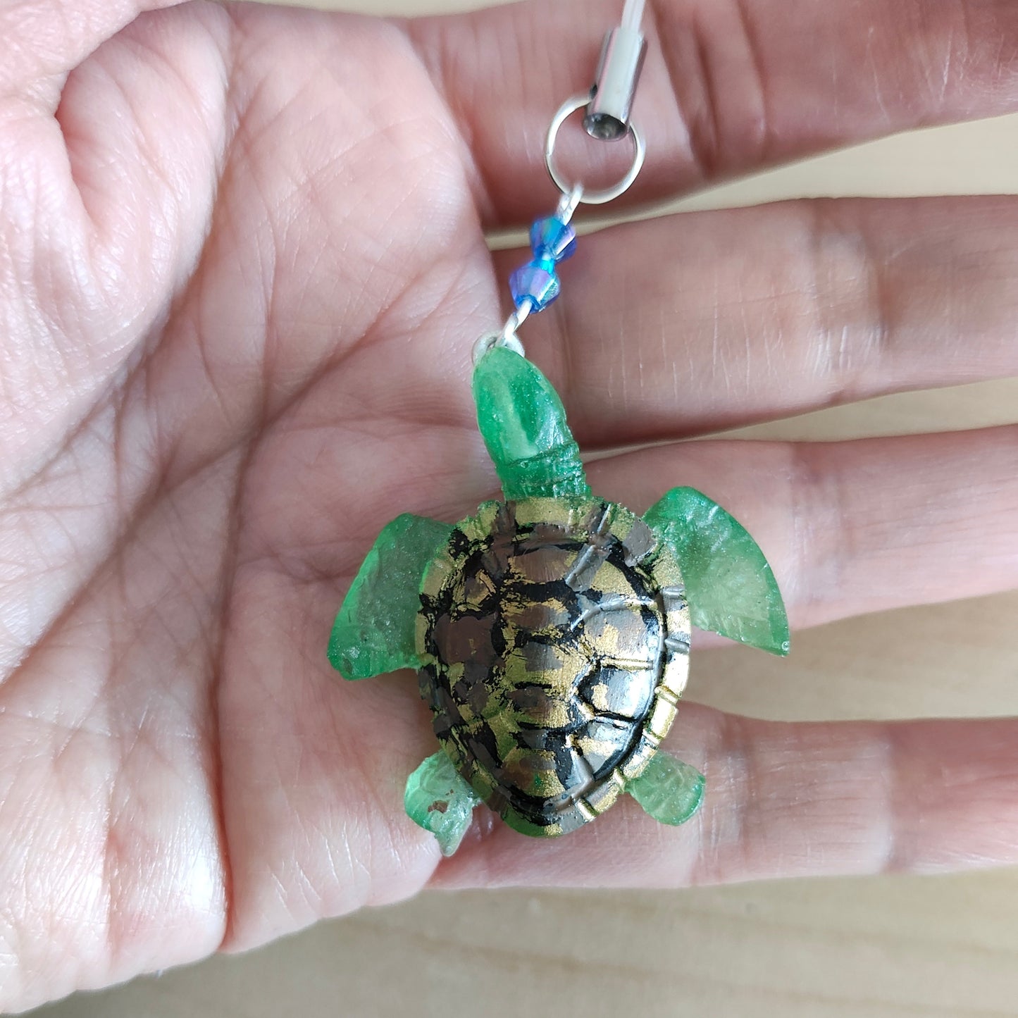 Make your phone stand out with this charming resin turtle adorned with colorful beads! At 4.5 inches long, it's a unique way to add personality to your device. Plus, it's lightweight and won't add bulk to your phone. Turtle-y awesome!

Phone charm - Resin turtle with beads

Length is approximately 4.5 in