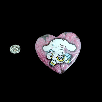 This 3D cinnamoroll resin pin is a must-have for any Sanrio lover! The delicate design and silver butterfly clutch add a touch of elegance to your pin collection. Show off your love for cute and unique accessories with this eye-catching pin.
