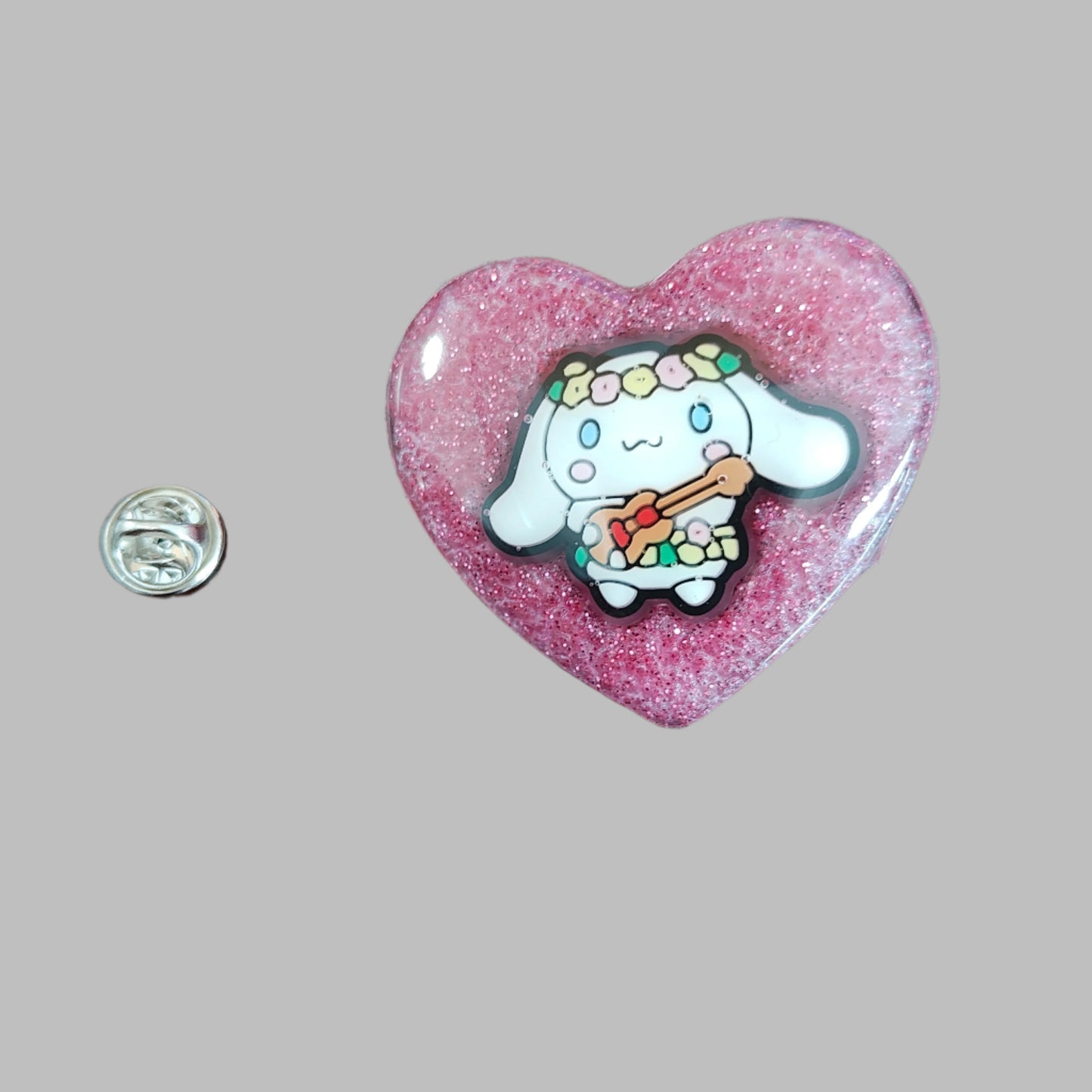 This 3D cinnamoroll resin pin is a must-have for any Sanrio lover! The delicate design and silver butterfly clutch add a touch of elegance to your pin collection. Show off your love for cute and unique accessories with this eye-catching pin.