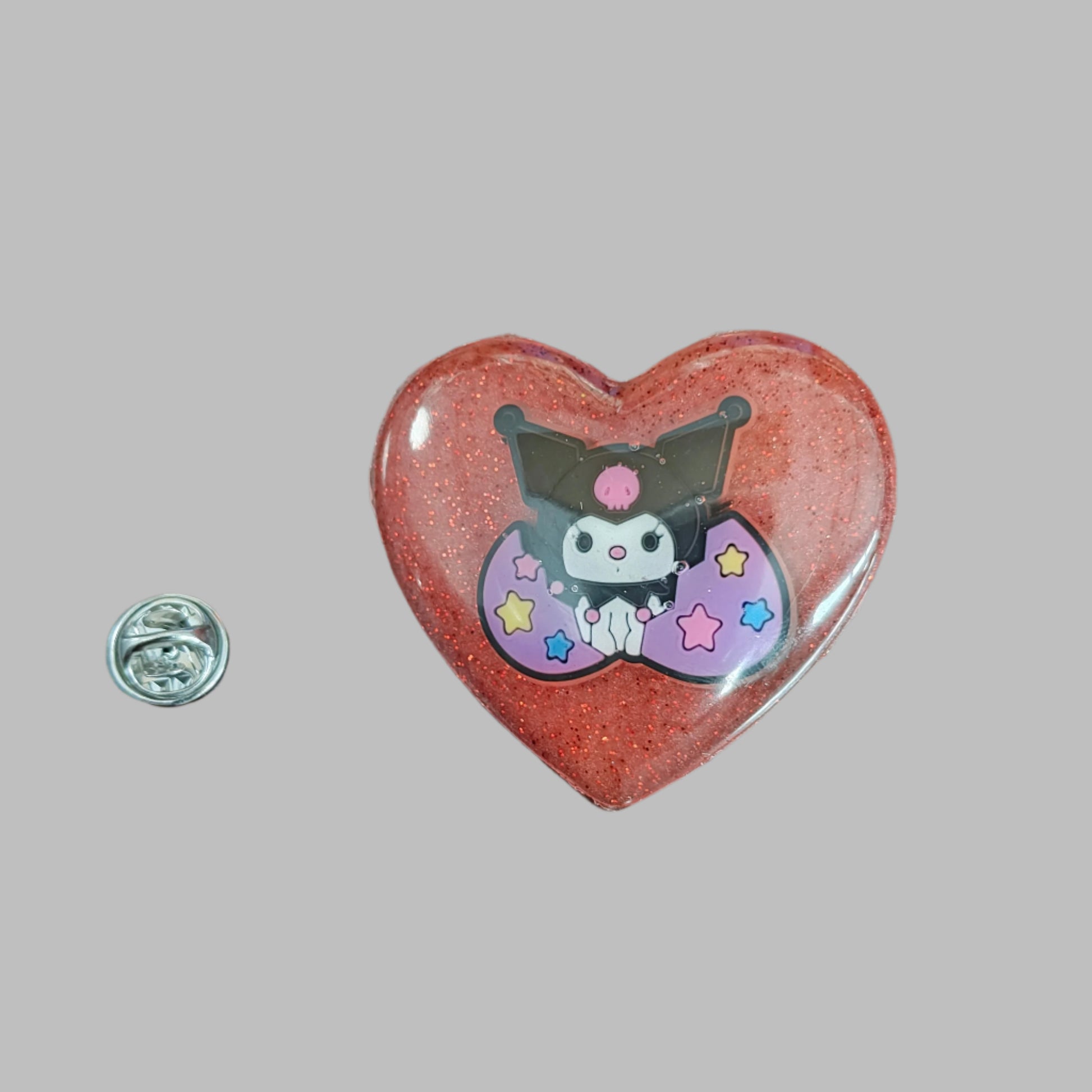 This 3D Kuromi resin pin is a must-have for any Sanrio lover! The delicate design and silver butterfly clutch add a touch of elegance to your pin collection. Show off your love for cute and unique accessories with this eye-catching pin.