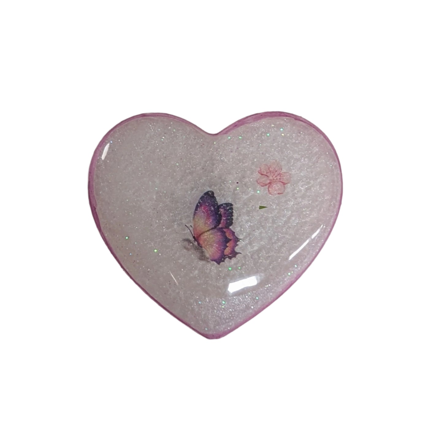 Wear your heart on your sleeve (or anywhere!) with this playful 3D resin heart pin. The silver butterfly clutch adds a touch of whimsy to this lightweight 0.40 oz accessory, measuring 1.75 x 2 in. Show your love with a pinch of quirkiness.

Pin - 3D resin heart pin with silver butterfly clutch