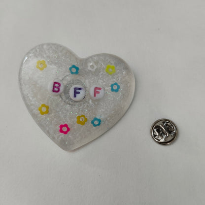 Wear your heart on your sleeve (or anywhere!) with this playful 3D resin heart pin. The silver butterfly clutch adds a touch of whimsy to this lightweight 0.40 oz accessory, measuring 1.75 x 2 in. Show your love with a pinch of quirkiness.