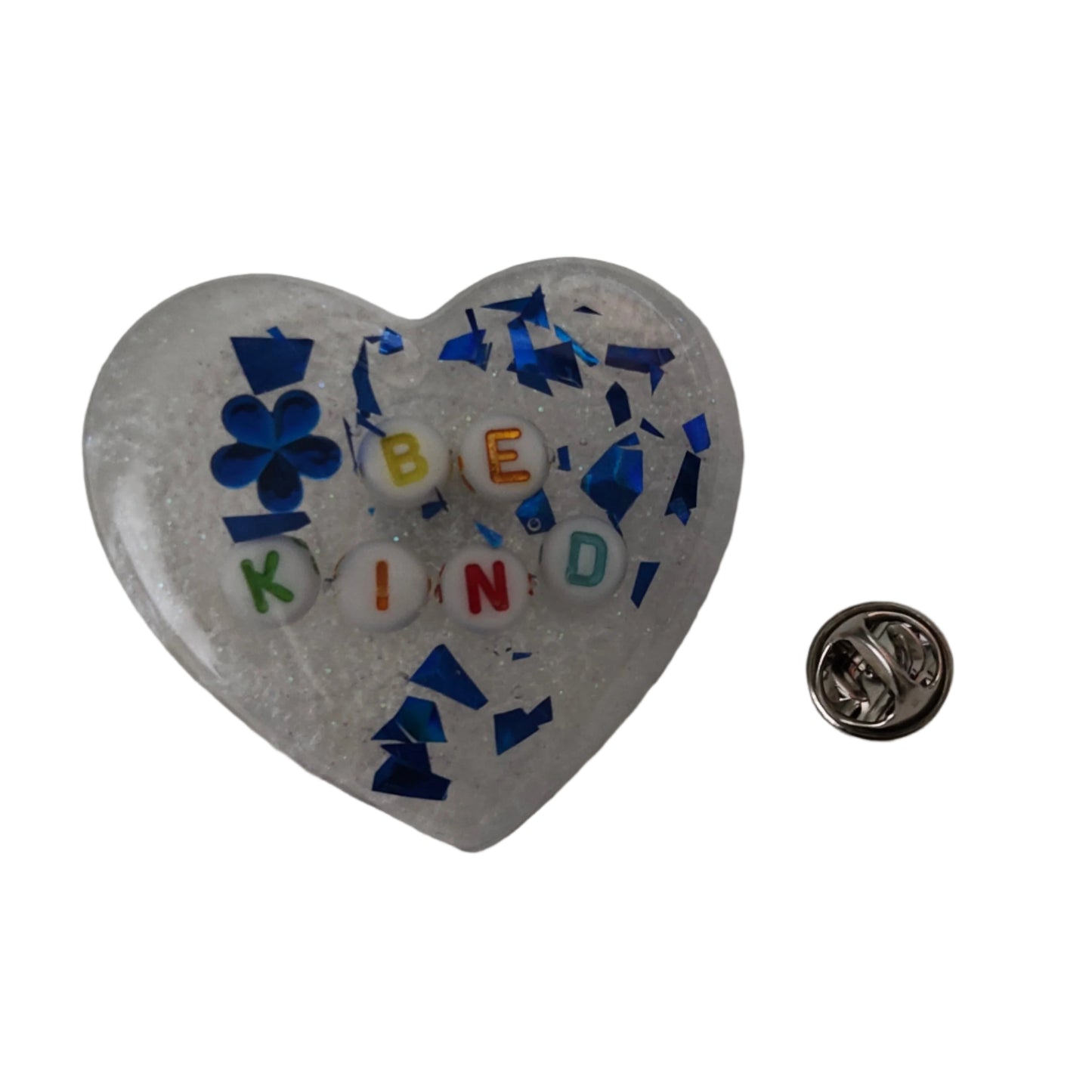 Wear your heart on your sleeve (or anywhere!) with this playful 3D resin heart pin. The silver butterfly clutch adds a touch of whimsy to this lightweight 0.40 oz accessory, measuring 1.75 x 2 in. Show your love with a pinch of quirkiness.