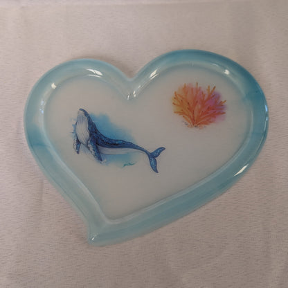 hand crafted with epoxy resin.

Epoxy resin is typically smooth, rigid, and non-porous, similar to a hard plastic or glass.