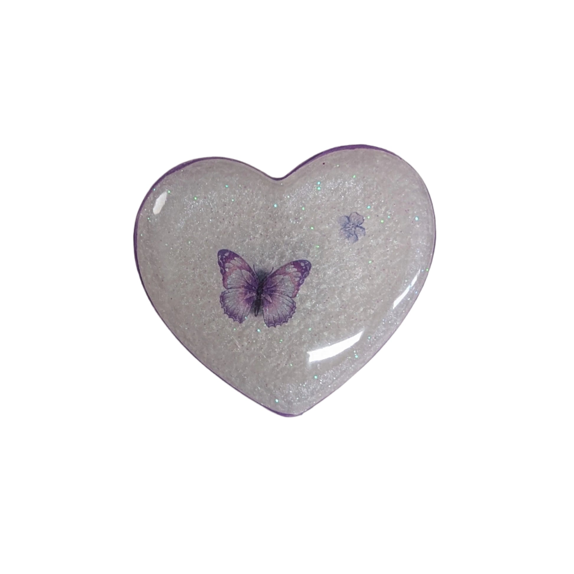 Wear your heart on your sleeve (or anywhere!) with this playful 3D resin heart pin. The silver butterfly clutch adds a touch of whimsy to this lightweight 0.40 oz accessory, measuring 1.75 x 2 in. Show your love with a pinch of quirkiness.

Pin - 3D resin heart pin with silver butterfly clutch