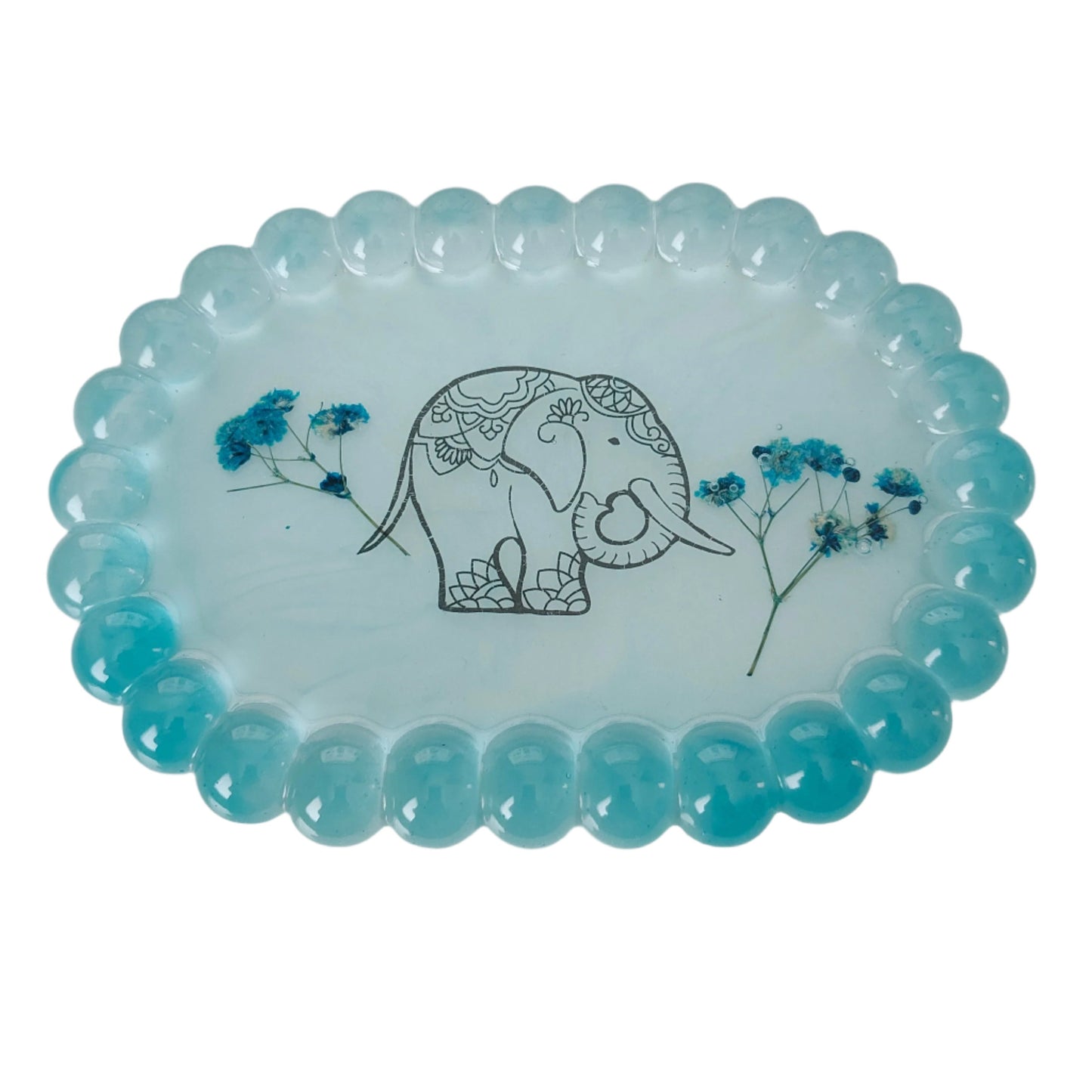 Organize and display your trinkets in style with our Resin Oval jewelry/Trinket Tray. Made from durable resin, this tray adds a touch of elegance to any space. Its unique oval shape and smooth finish make it perfect for storing your small items. Keep your trinkets safe and organized with this beautiful tray!