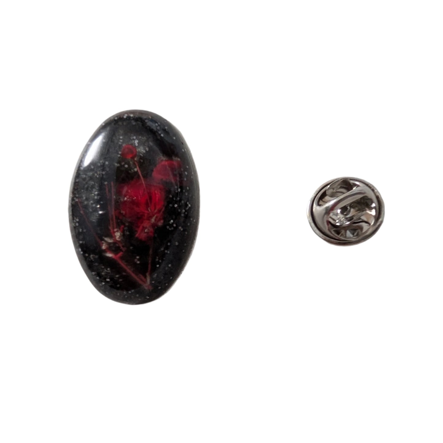 Add a touch of nature to your outfit with our Pin - 3D dried flower resin pin. The intricate design and 3D effect will surely catch everyone's eye. With the sturdy silver butterfly clutch, your pin will stay securely in place. Elevate your style with this unique and beautiful accessory.