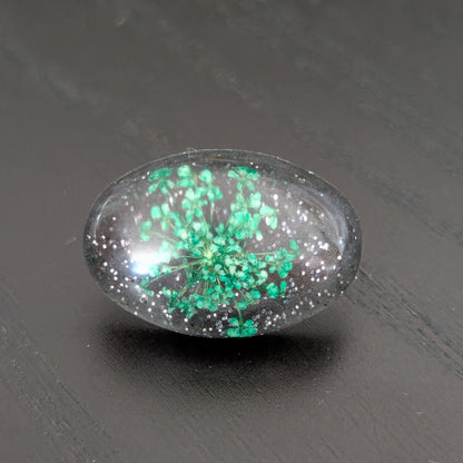 Add a touch of whimsy to any outfit with our 3D dried flower in resin pin. The stunning silver butterfly clutch ensures secure and easy attachment. Let this pin be your new go-to accessory for an elevated and playful look!